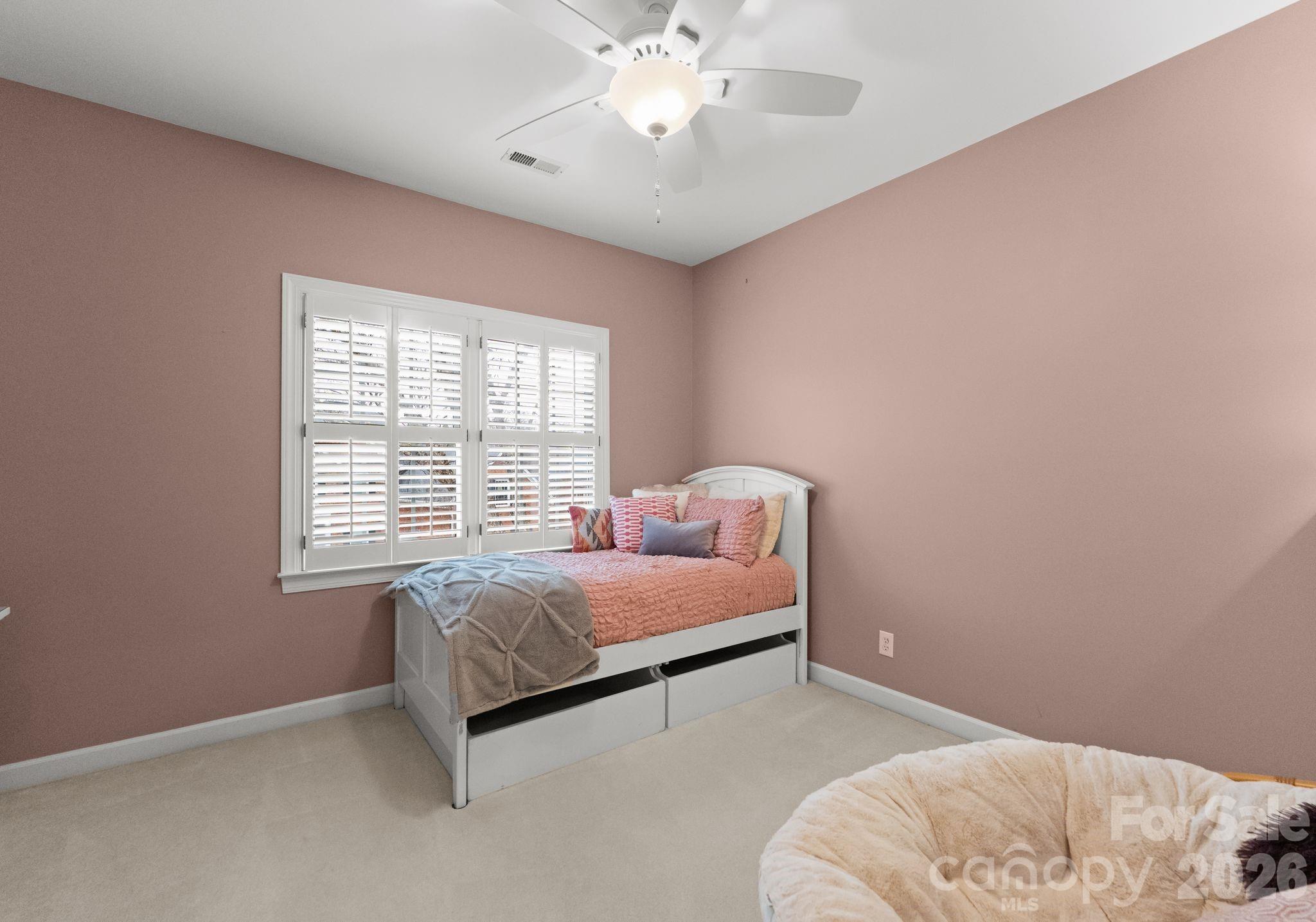 10012 Paradise Ridge Road Charlotte, NC 28277 - Photo 33 of 48 a bed room with a bed and a chandelier
