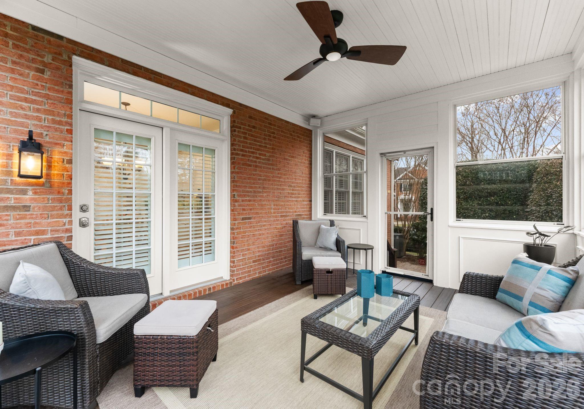 10012 Paradise Ridge Road Charlotte, NC 28277 - Photo 37 of 48 a living room with furniture a flat screen tv and a large window