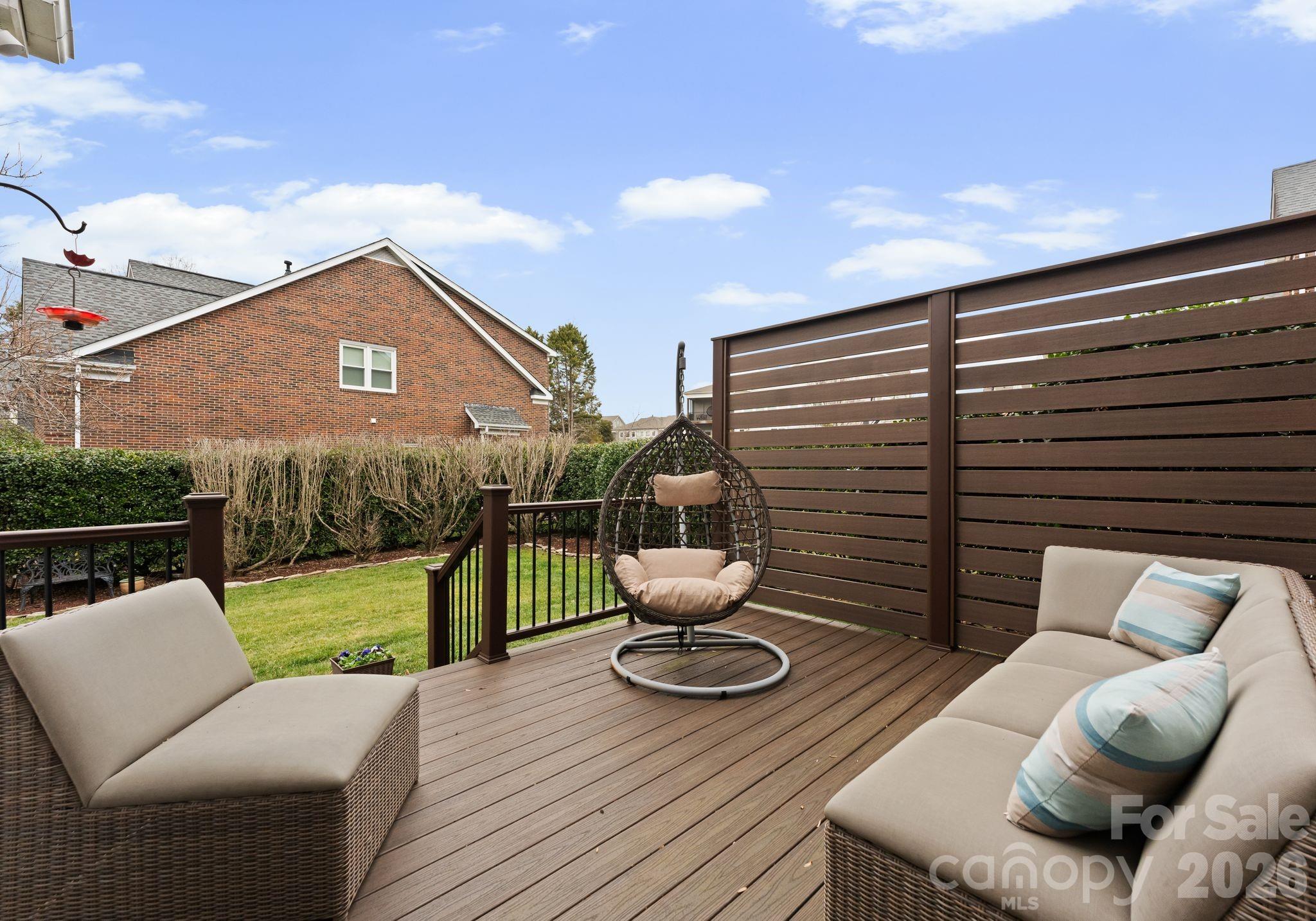 10012 Paradise Ridge Road Charlotte, NC 28277 - Photo 38 of 48 a view of a patio with couches chairs and a potted plant