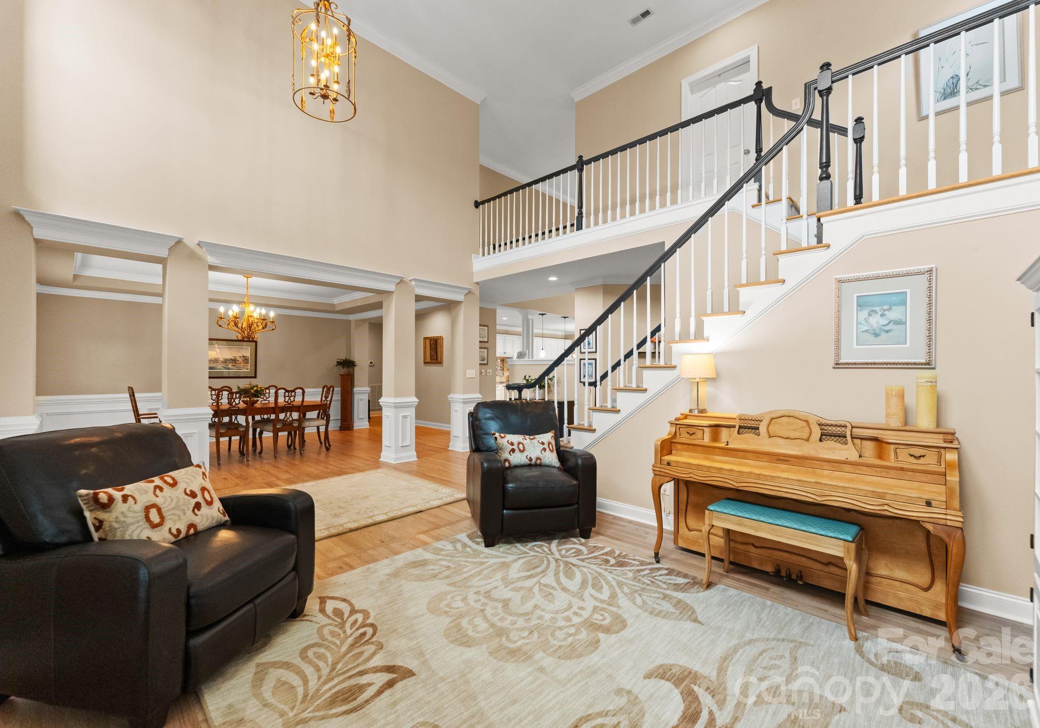 10012 Paradise Ridge Road Charlotte, NC 28277 - Photo 4 of 48 a living room with furniture and a piano
