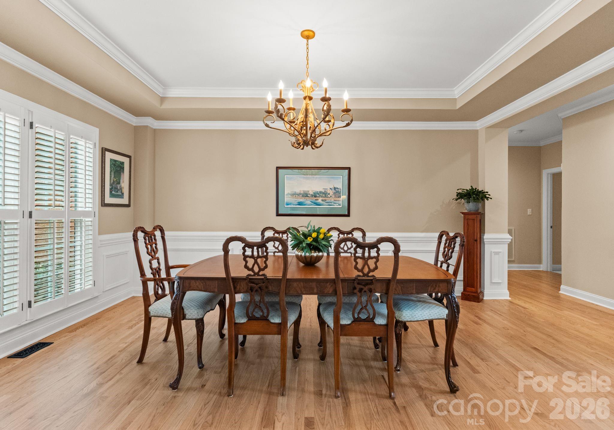 10012 Paradise Ridge Road Charlotte, NC 28277 - Photo 7 of 48 a view of a dining room with furniture wooden floor and chandelier