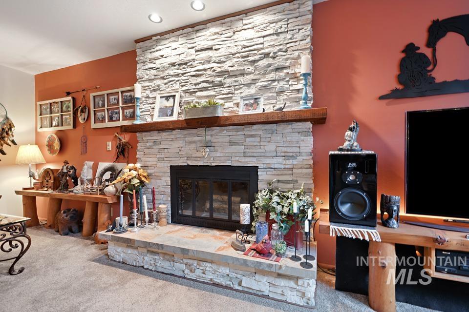 9518 Scorpio Street Boise, ID 83709 - Photo 13 of 46 Living area featuring a fireplace and carpet floors