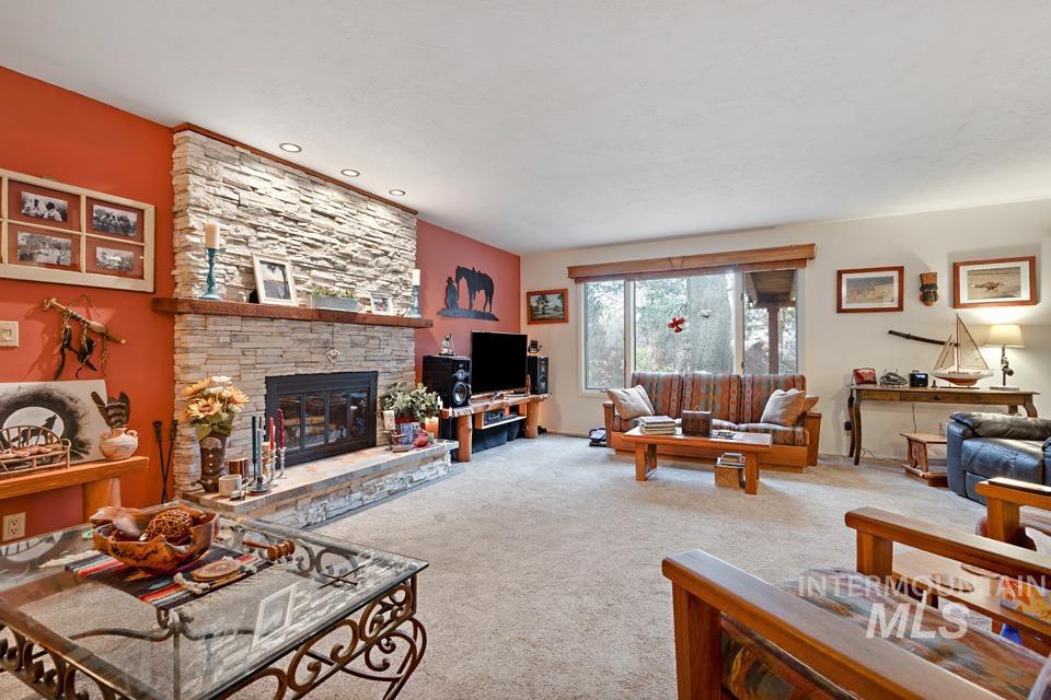9518 Scorpio Street Boise, ID 83709 - Photo 14 of 46 Carpeted living area featuring a fireplace