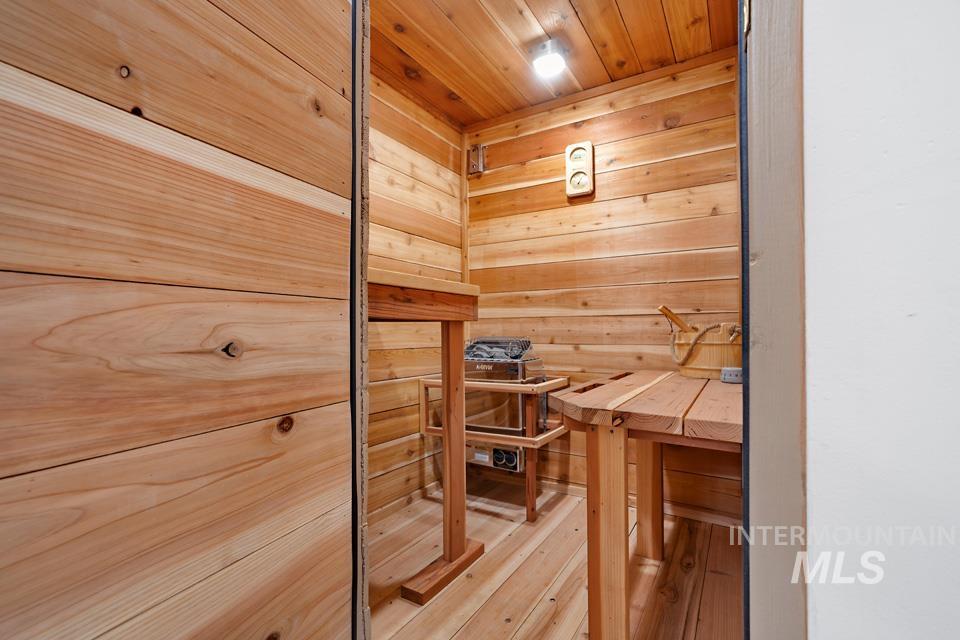 9518 Scorpio Street Boise, ID 83709 - Photo 31 of 46 Relaxing sauna with wood ceiling, hardwood / wood-style flooring, and wood walls
