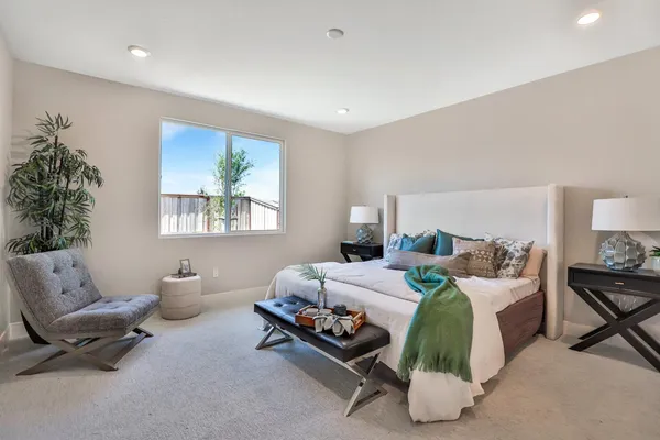 a bedroom with bed and a window