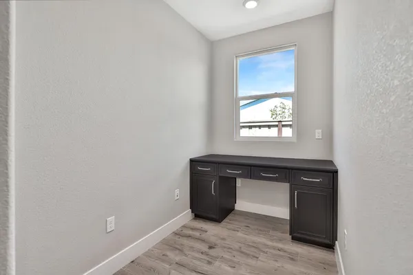 a room with a window and mirror