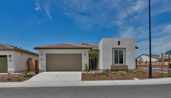 a front view of a house with a garage