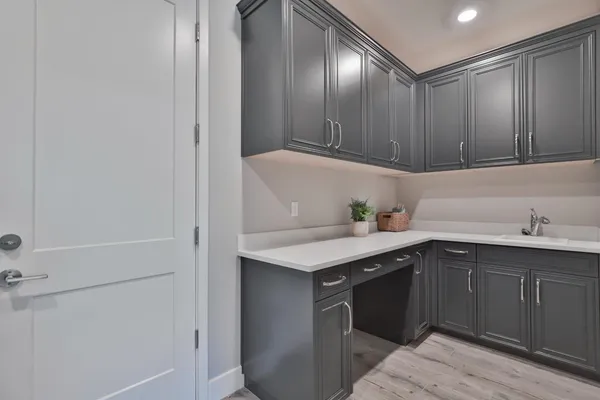a kitchen with a sink and cabinets