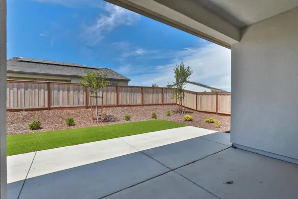 a view of backyard with a swimming pool