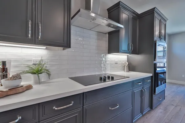 a kitchen with a sink and cabinets
