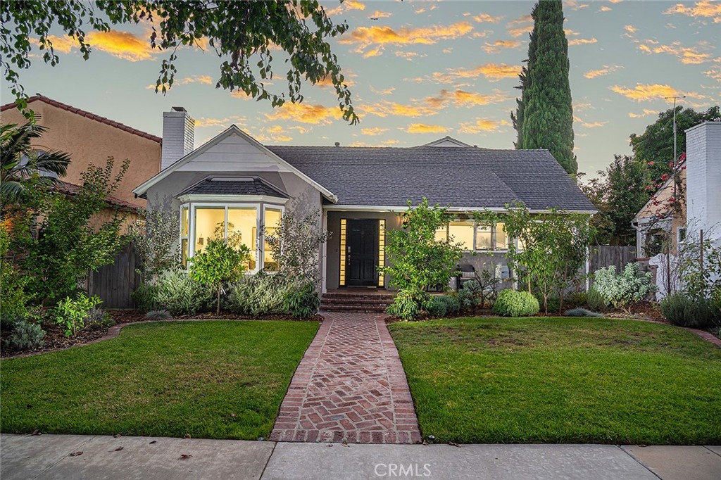611 Flint Avenue Long Beach, CA 90814 - Photo 1 of 48 a front view of a house with garden