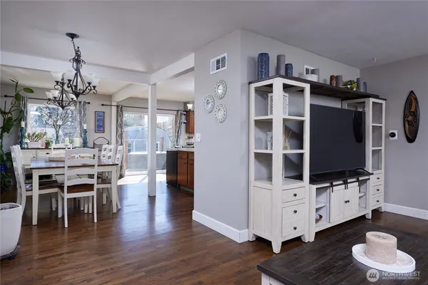 a living room with furniture and flat screen tv