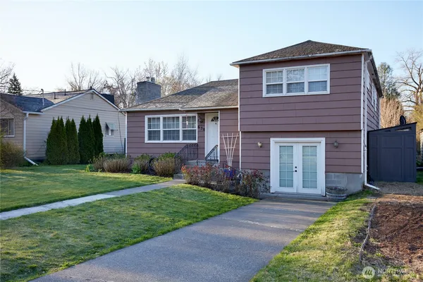 a front view of a house with a yard