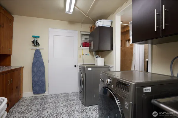 a kitchen with a refrigerator and a sink