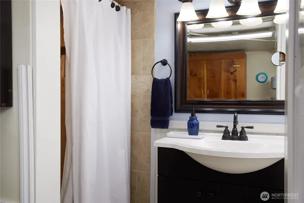a bathroom with a sink and a mirror