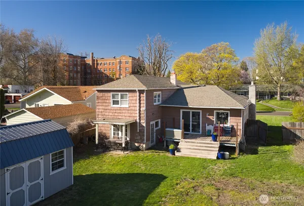 a view of a house with a yard porch and sitting area