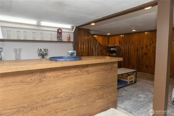 a view of kitchen with cabinets
