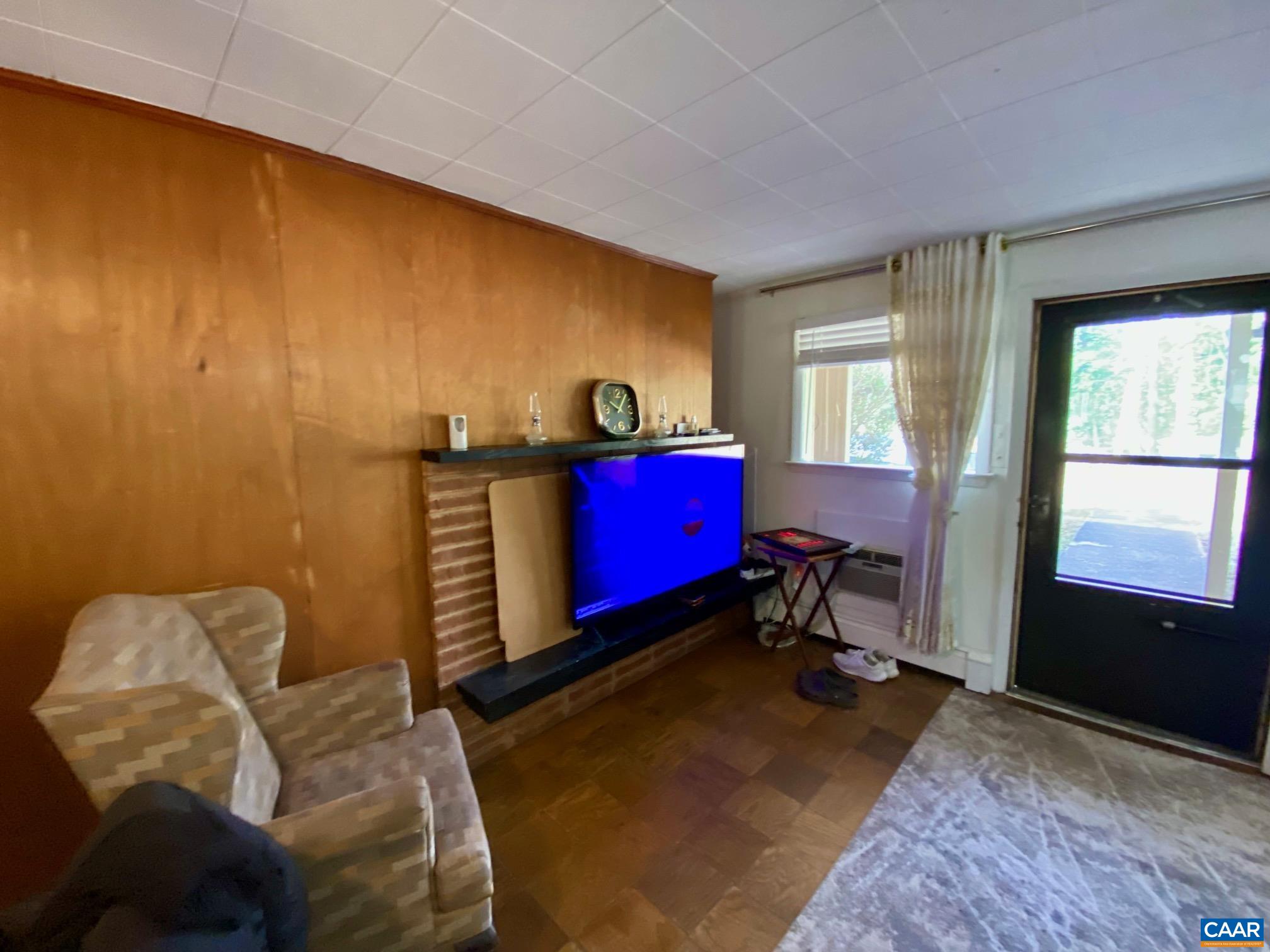 115 Apple Tree Road Charlottesville, VA 22903 - Photo 11 of 17 a living room with furniture and a window