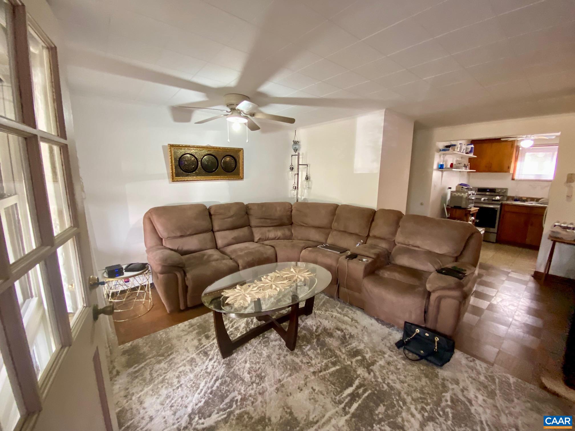 115 Apple Tree Road Charlottesville, VA 22903 - Photo 10 of 17 a living room with furniture and a flat screen tv