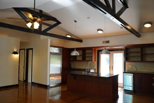 a stove top oven sitting inside of a kitchen