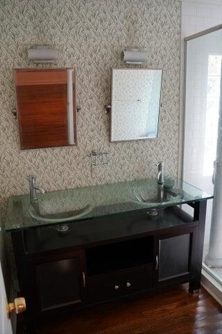 5215 North Flagler Drive West Palm Beach, FL 33407 - Photo 24 of 37 a bathroom with a sink and a mirror