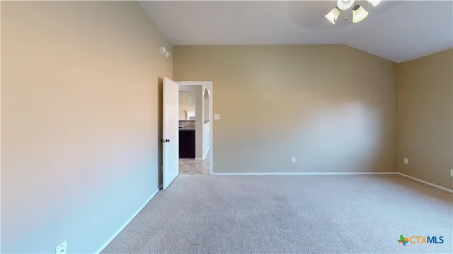 an empty room with a empty space and a window