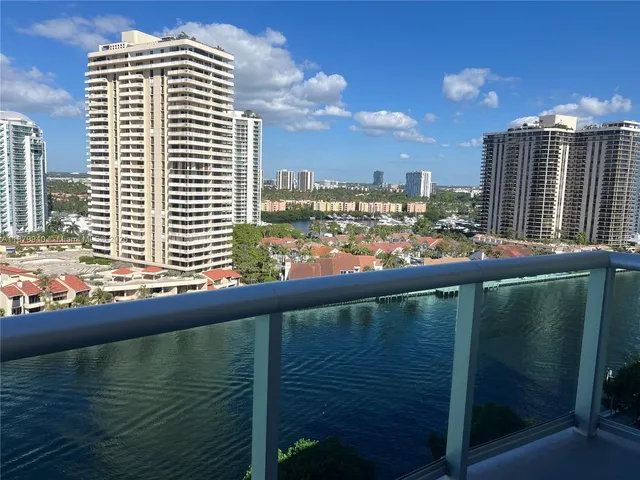 a view of swimming pool with outdoor seating and lake view