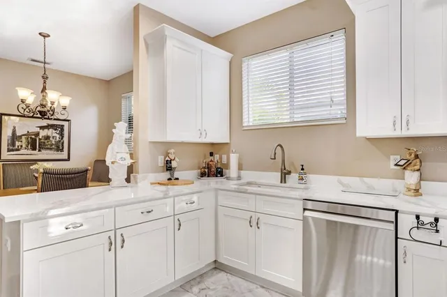a kitchen with sink cabinets and window