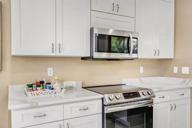 a kitchen with a stove and a microwave