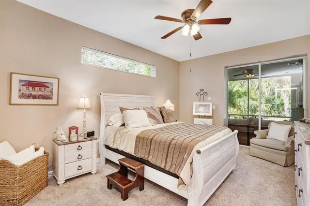 a bed room with a bed and a chandelier