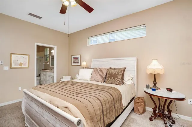 a bedroom with bed and a lamp