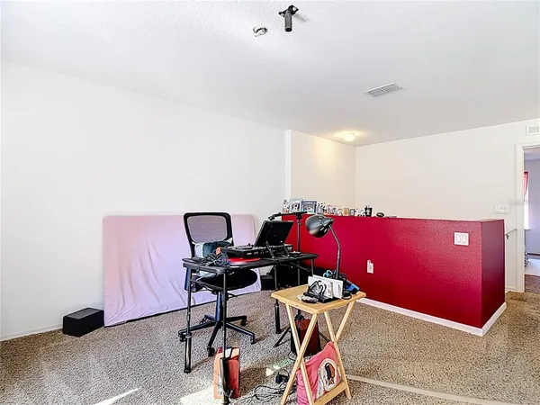 a workspace with furniture and mirror