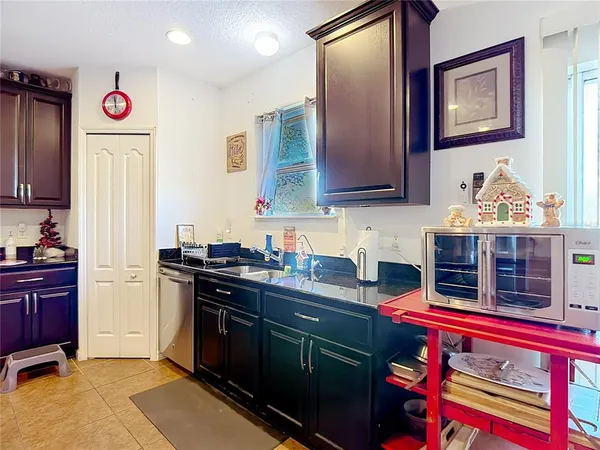 a kitchen with stainless steel appliances granite countertop a stove and a refrigerator
