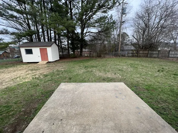 a backyard of a house with lots of green space