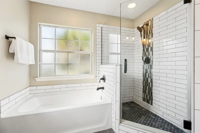 a bathroom with double vanity sink and a mirror