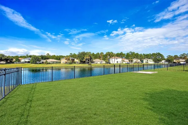 a view of house with backyard