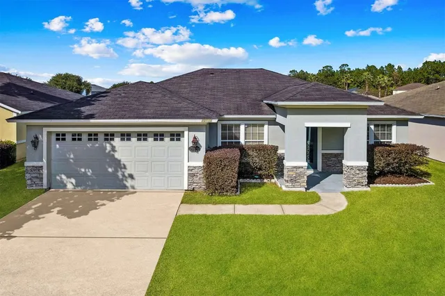 a view of a lake with houses in the background