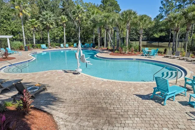 a front view of a house with a big yard