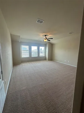 a view of empty room with windows