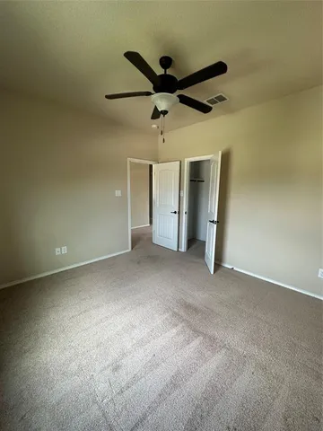 a view of empty room with windows