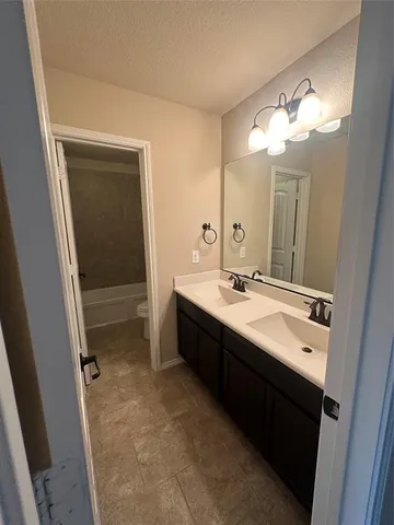 a view of a closet with wooden floor