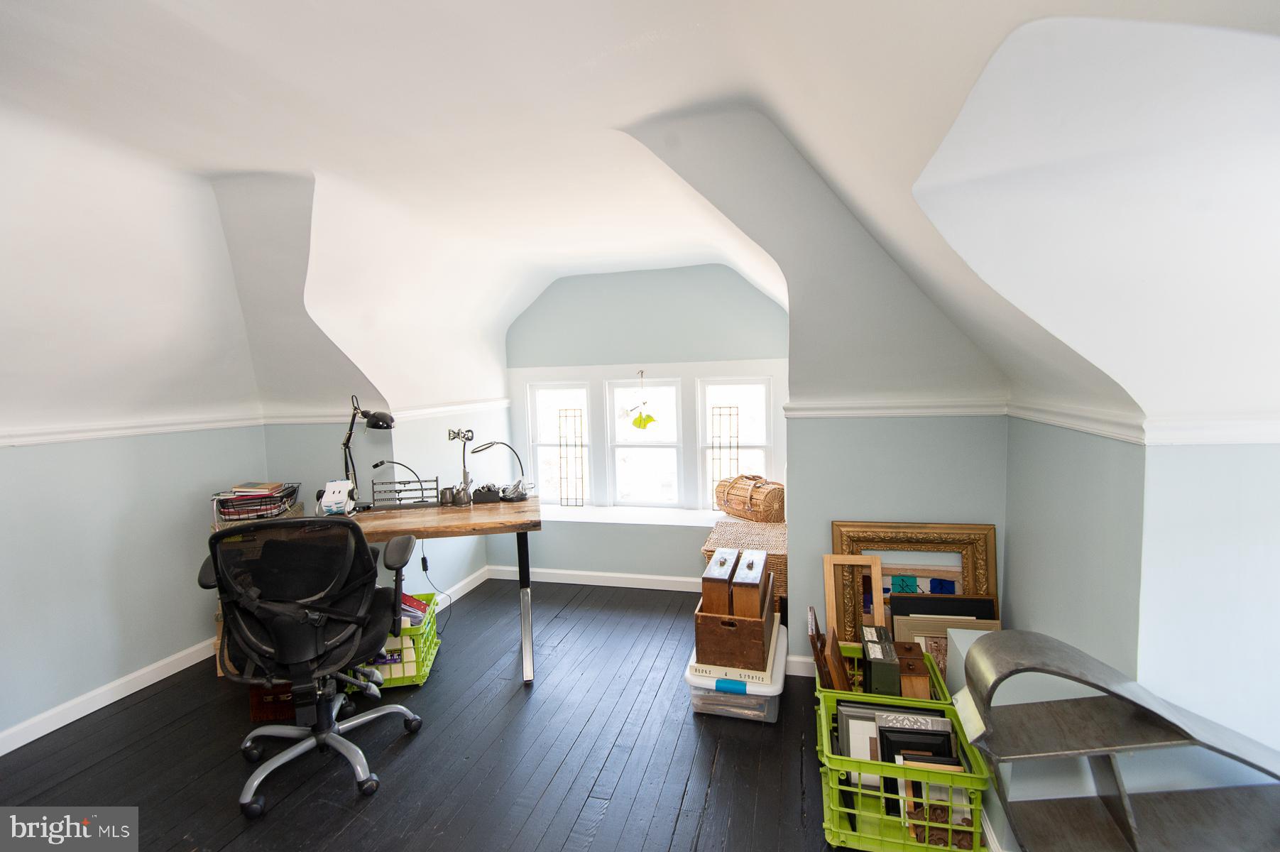 606 Locust Street Cambridge, MD 21613 - Photo 32 of 37 a view of a workspace with furniture and a window