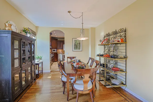 a dining room with furniture and wooden floor