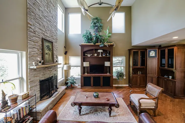 a living room with furniture a rug and a fireplace