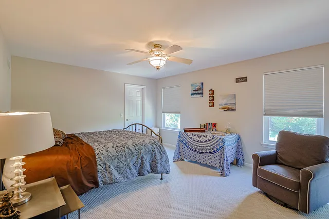 a bedroom with furniture and a chandelier