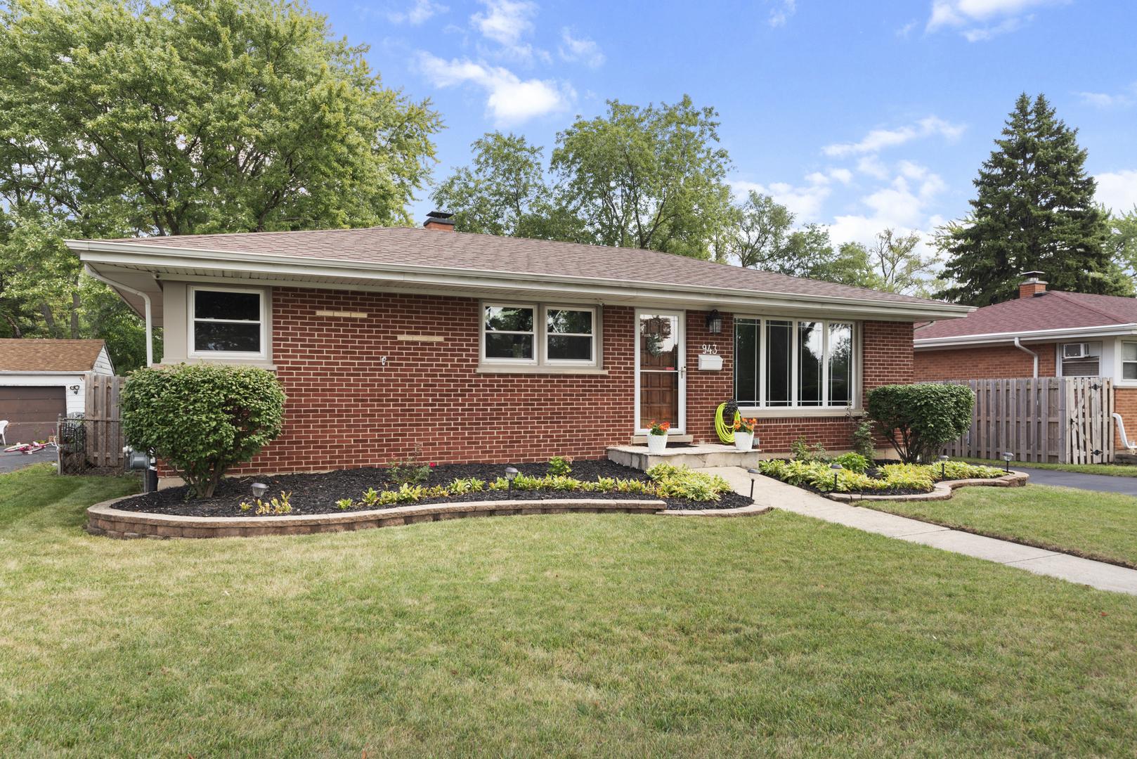 943 Sumner Street Addison, IL 60101 - Photo 1 of 20 a front view of a house with a yard
