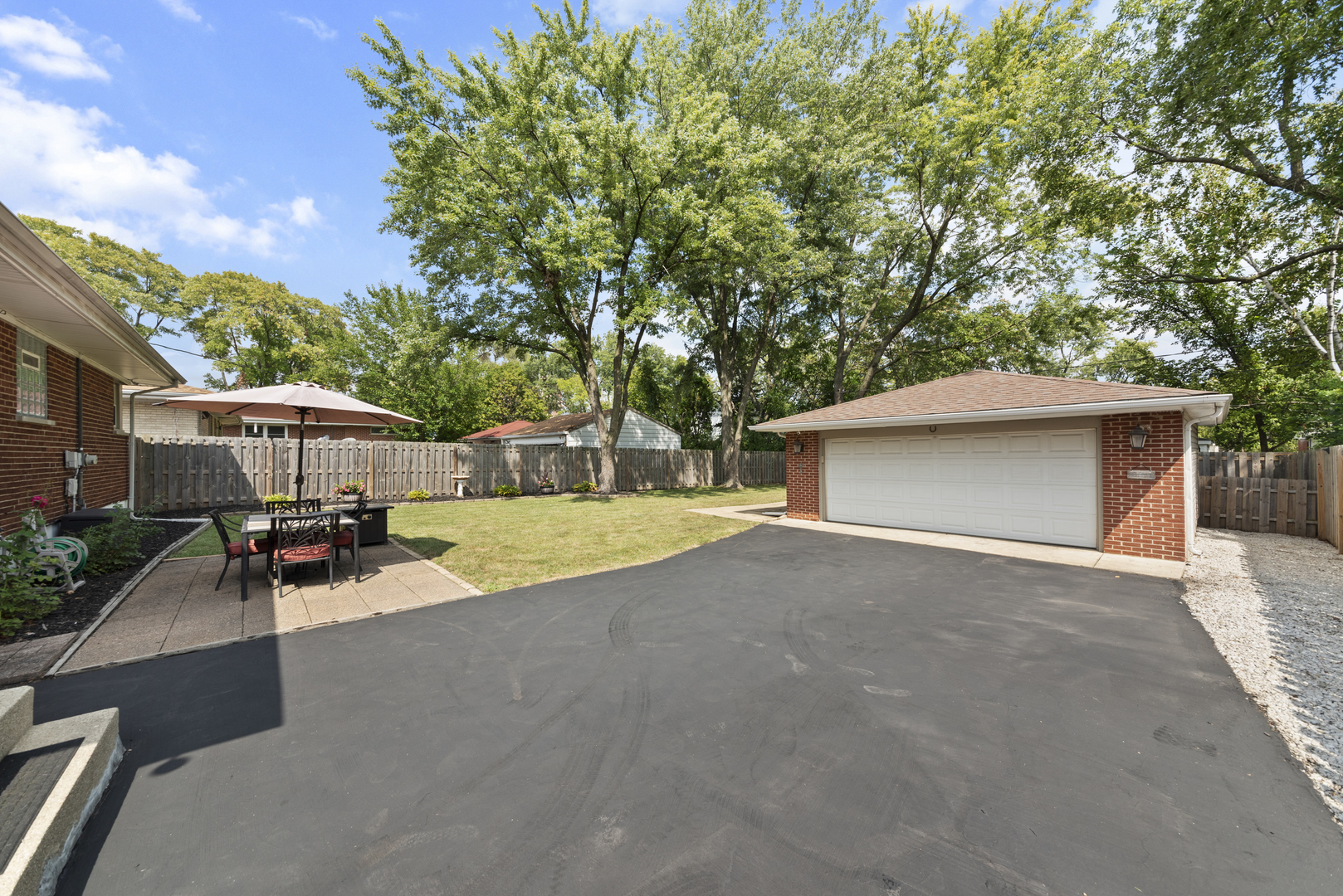 943 Sumner Street Addison, IL 60101 - Photo 19 of 20 a view of a house with backyard and sitting area