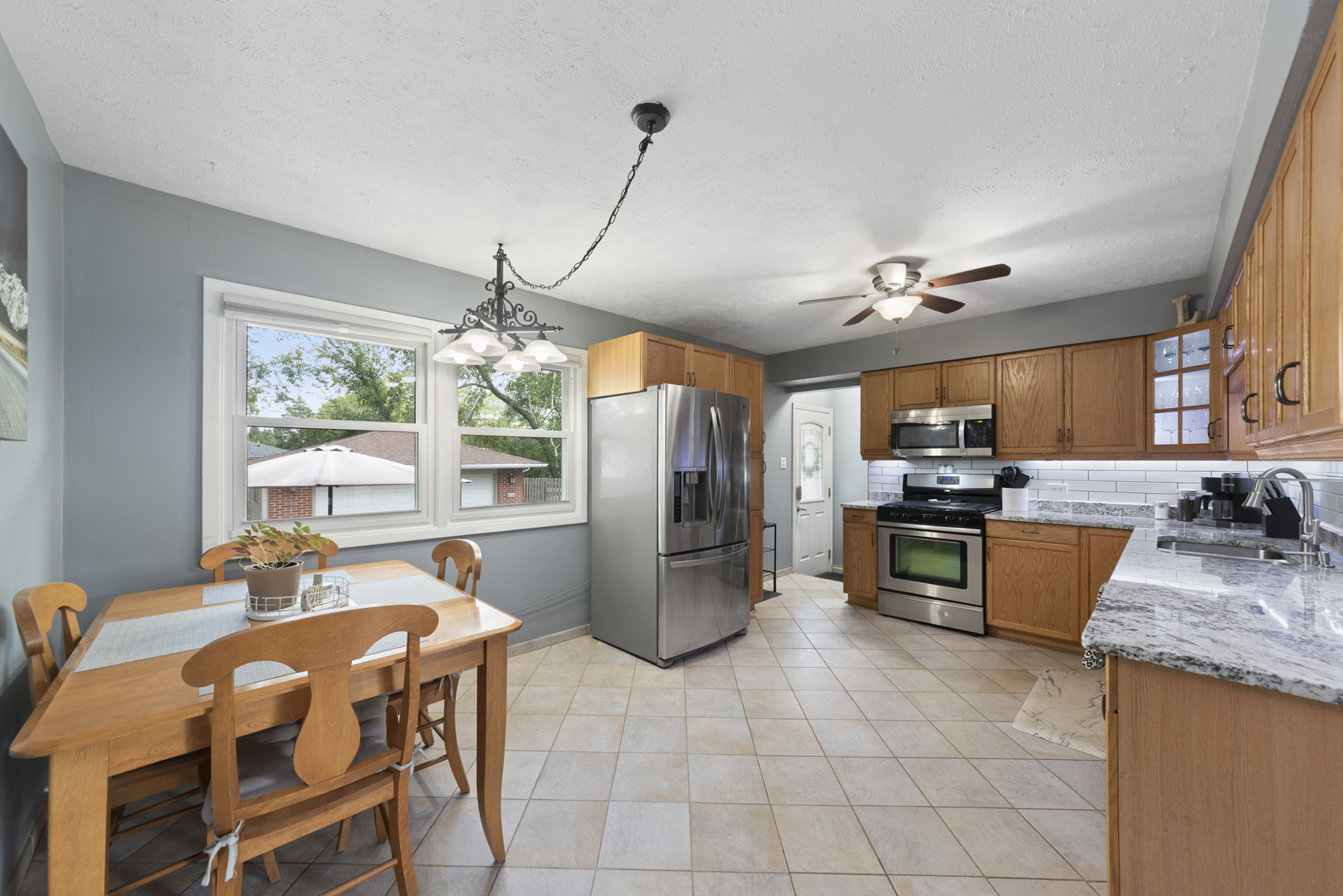943 Sumner Street Addison, IL 60101 - Photo 5 of 20 a kitchen with a refrigerator and a sink