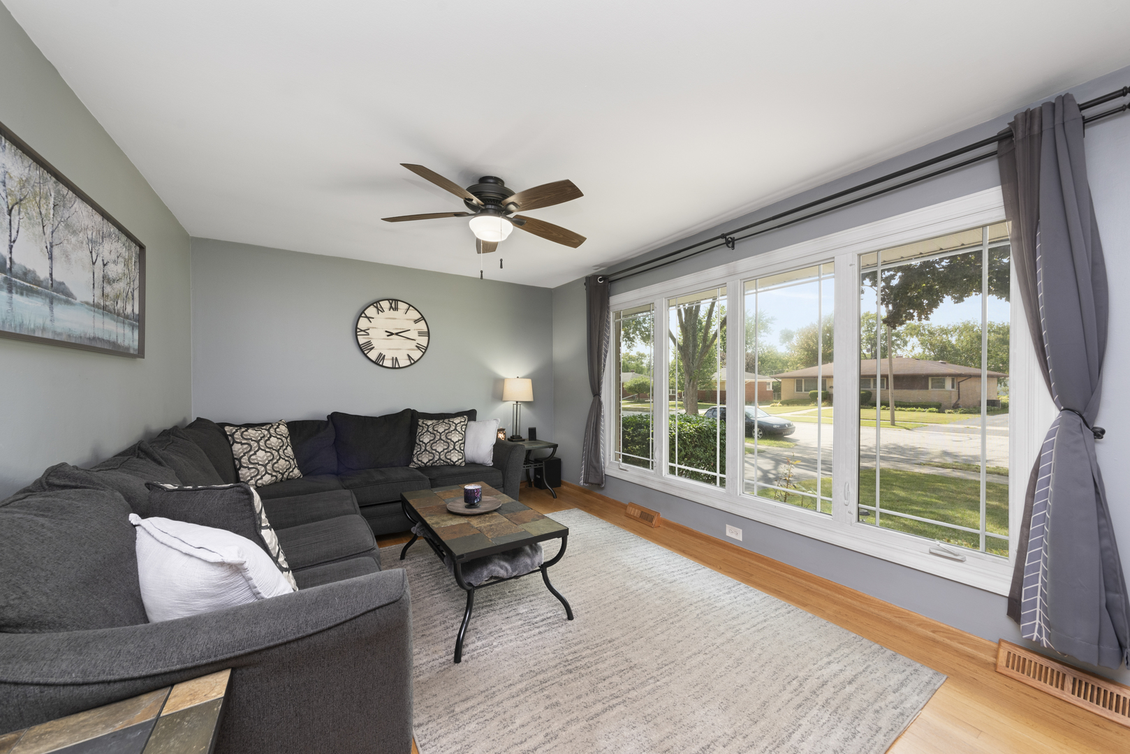 943 Sumner Street Addison, IL 60101 - Photo 7 of 20 a living room with furniture and a large window