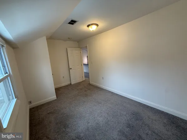 a bathroom with a toilet sink and shower